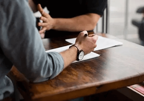 People negotiating on a conference table